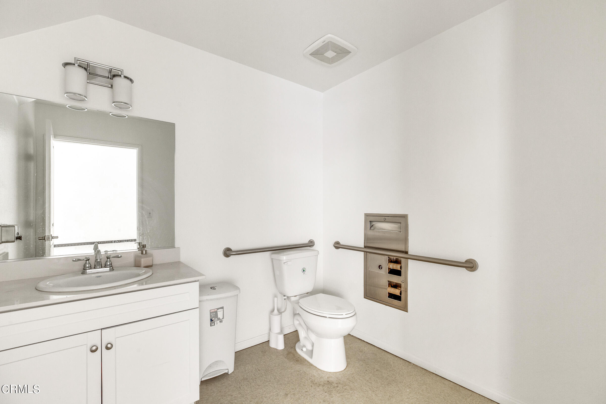 410 West Main Street, Unit 231 Alhambra, CA 91801 - Photo 9 of 45 a bathroom with a toilet a sink and mirror