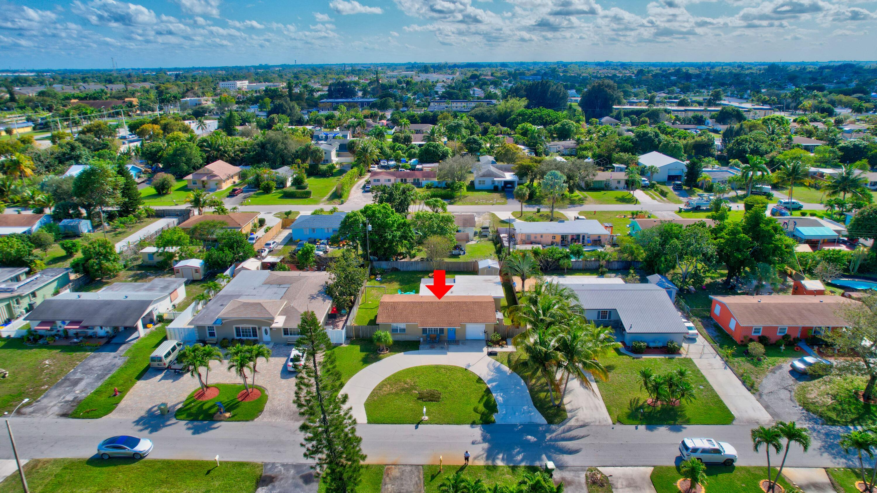 125 Riley Avenue Palm Springs, FL 33461 - Photo 22 of 24 an aerial view of multiple house