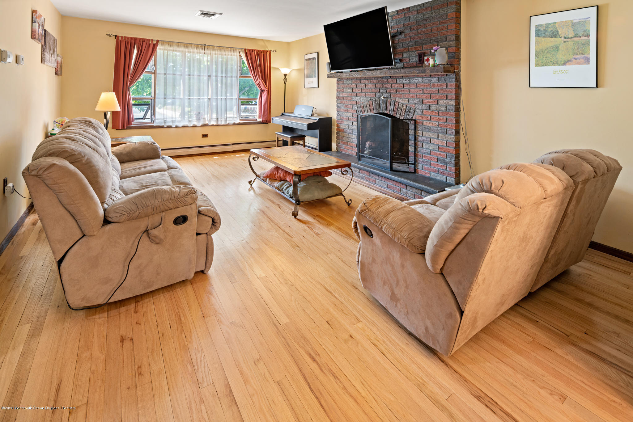 71 Broadway Keyport, NJ 07735 - Photo 12 of 27 a living room with furniture fireplace and flat screen tv