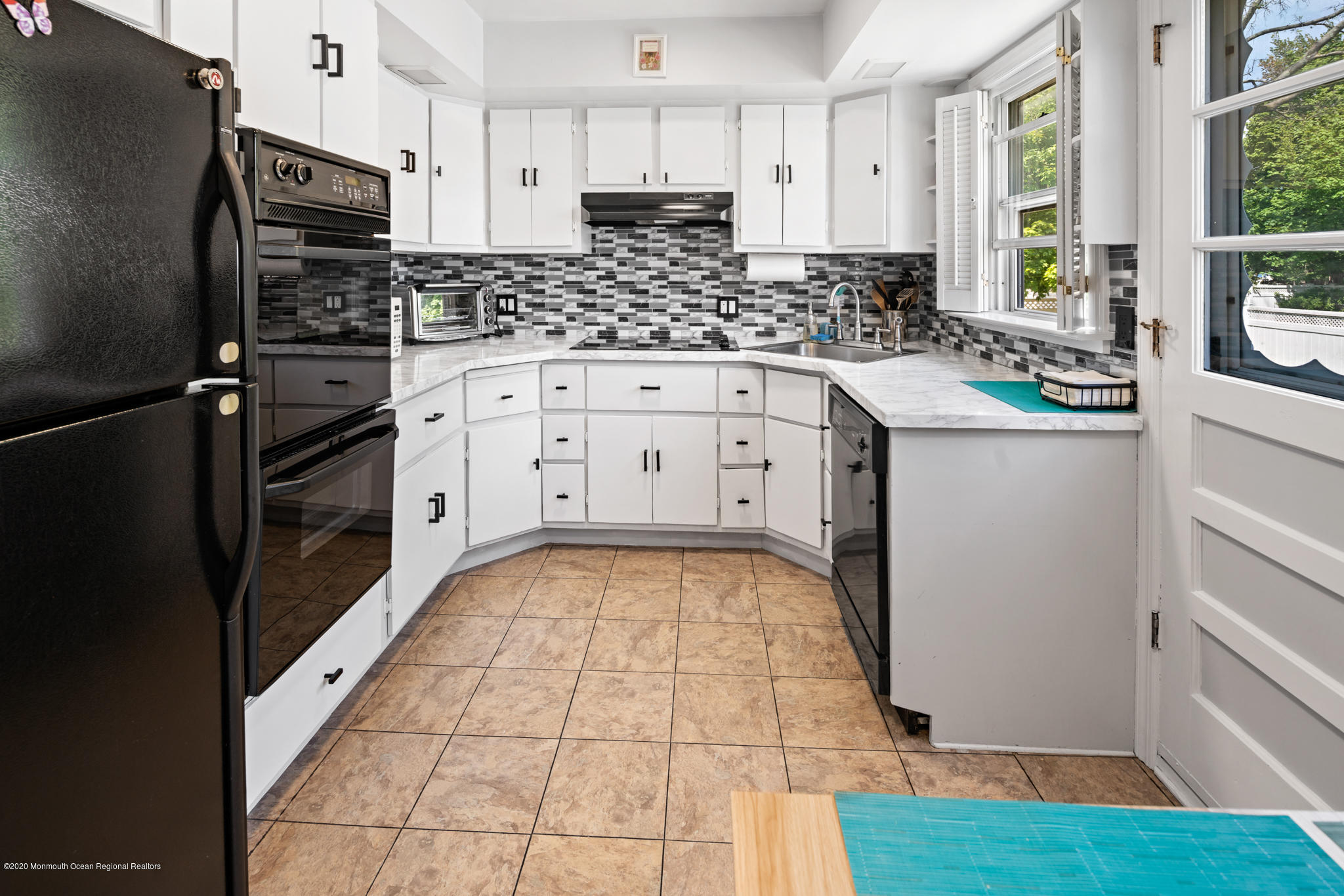 71 Broadway Keyport, NJ 07735 - Photo 16 of 27 a kitchen with stainless steel appliances a refrigerator sink and cabinets