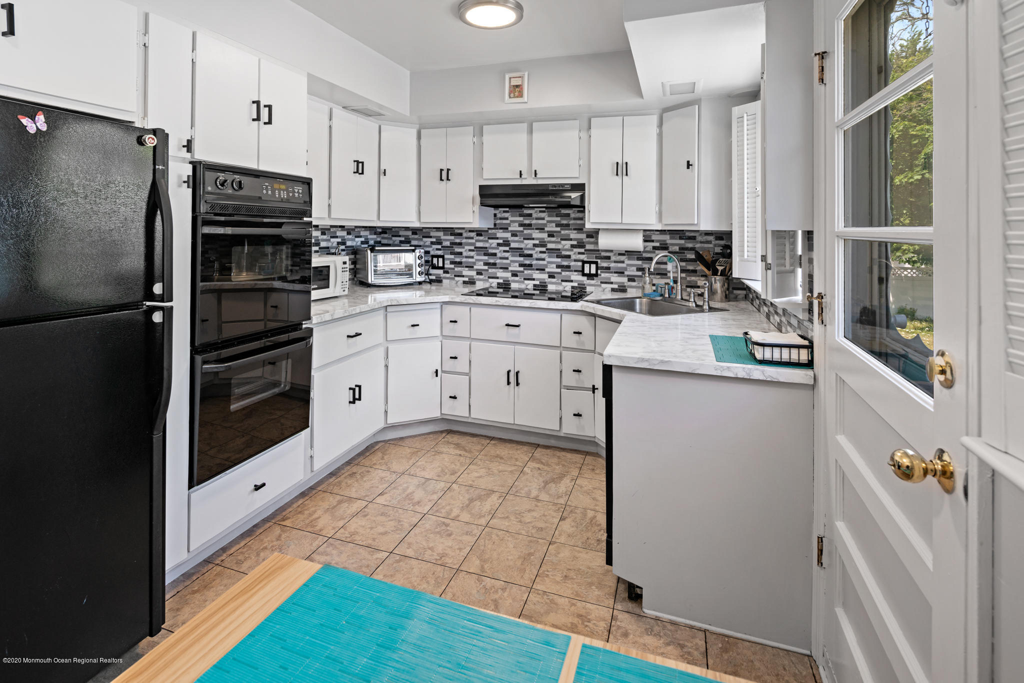 71 Broadway Keyport, NJ 07735 - Photo 17 of 27 a kitchen with granite countertop a refrigerator and a stove top oven