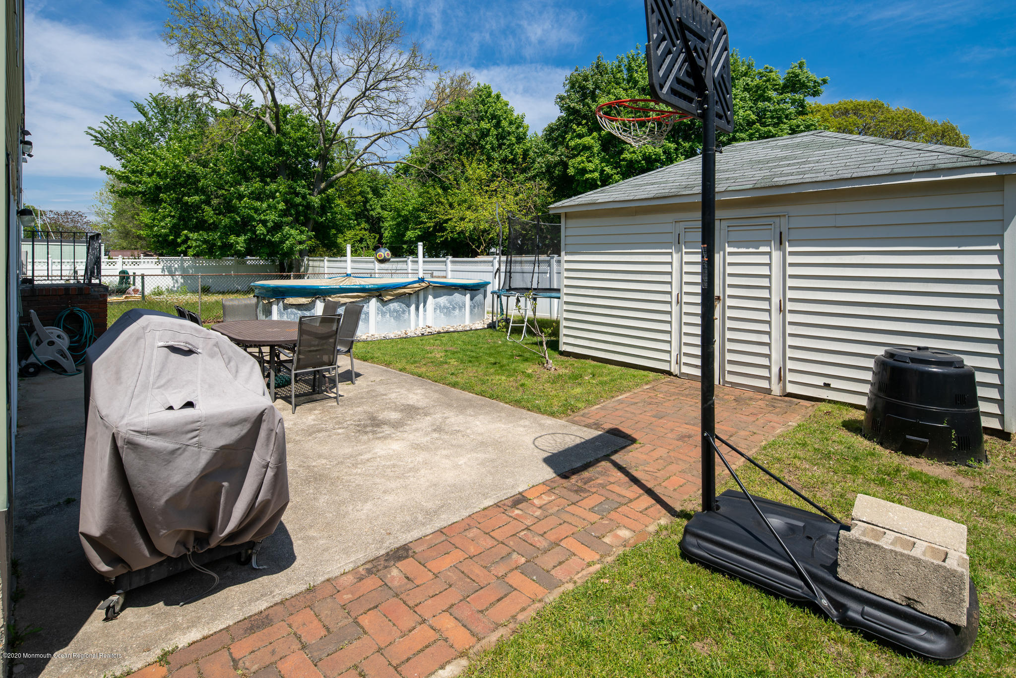 71 Broadway Keyport, NJ 07735 - Photo 25 of 27 a view of backyard with barbeque grill and wooden fence