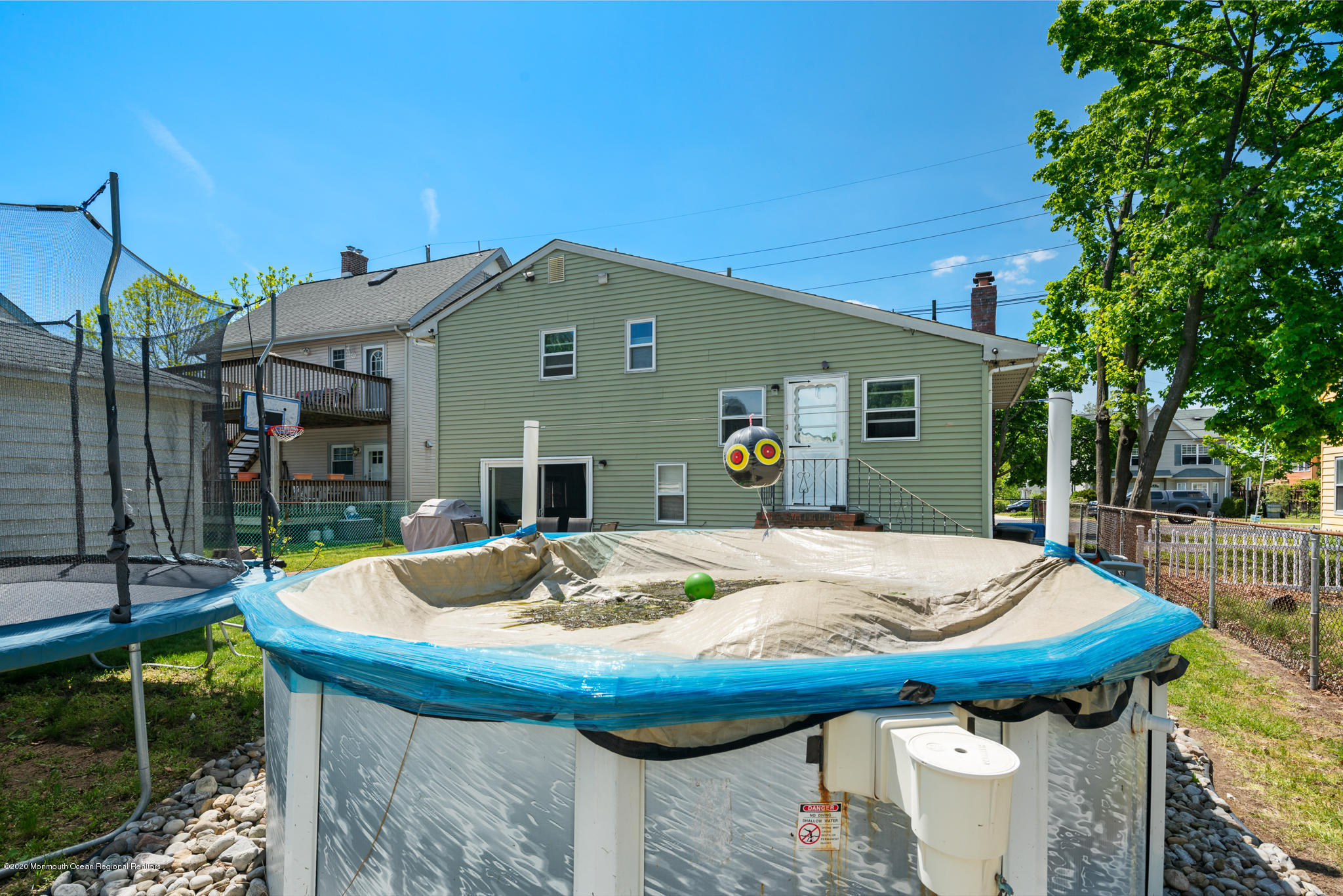 71 Broadway Keyport, NJ 07735 - Photo 26 of 27 a view of a dinning table and chairs in the patio