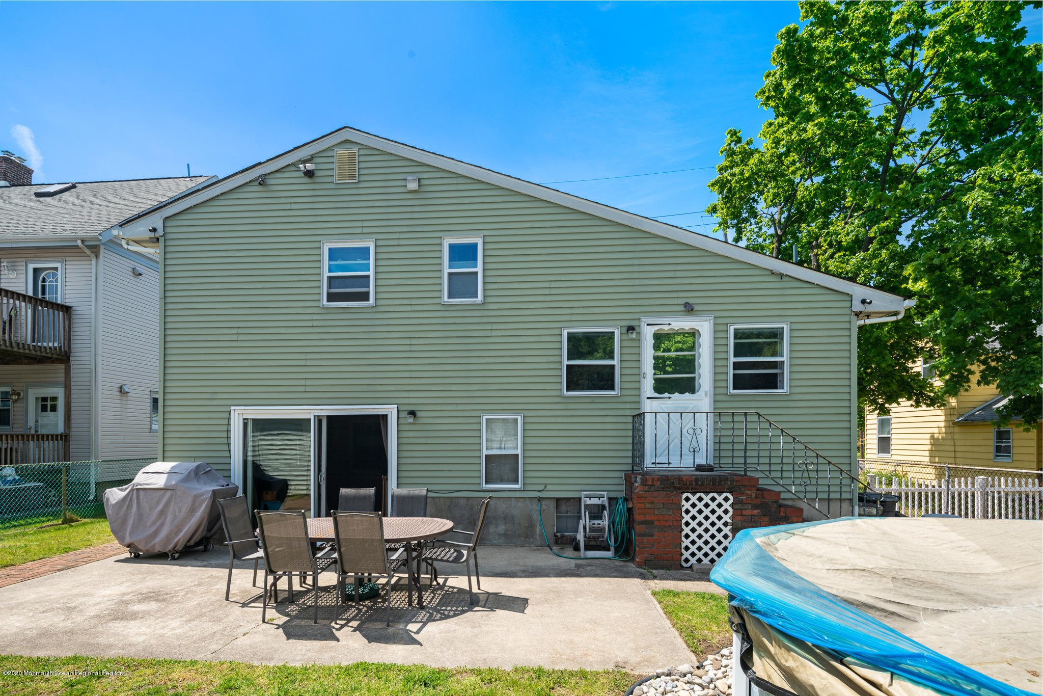 71 Broadway Keyport, NJ 07735 - Photo 27 of 27 a front view of house with yard outdoor seating and barbeque oven
