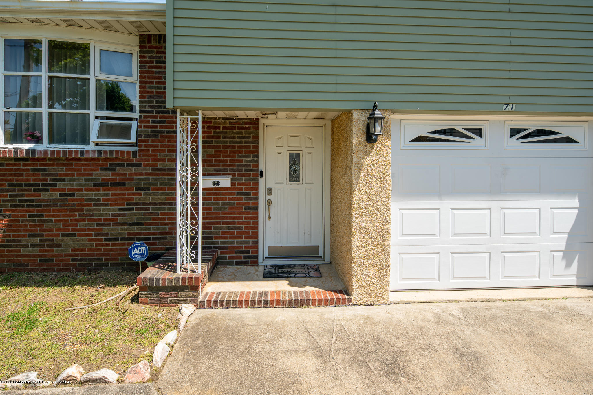 71 Broadway Keyport, NJ 07735 - Photo 4 of 27 a front view of a house with a yard