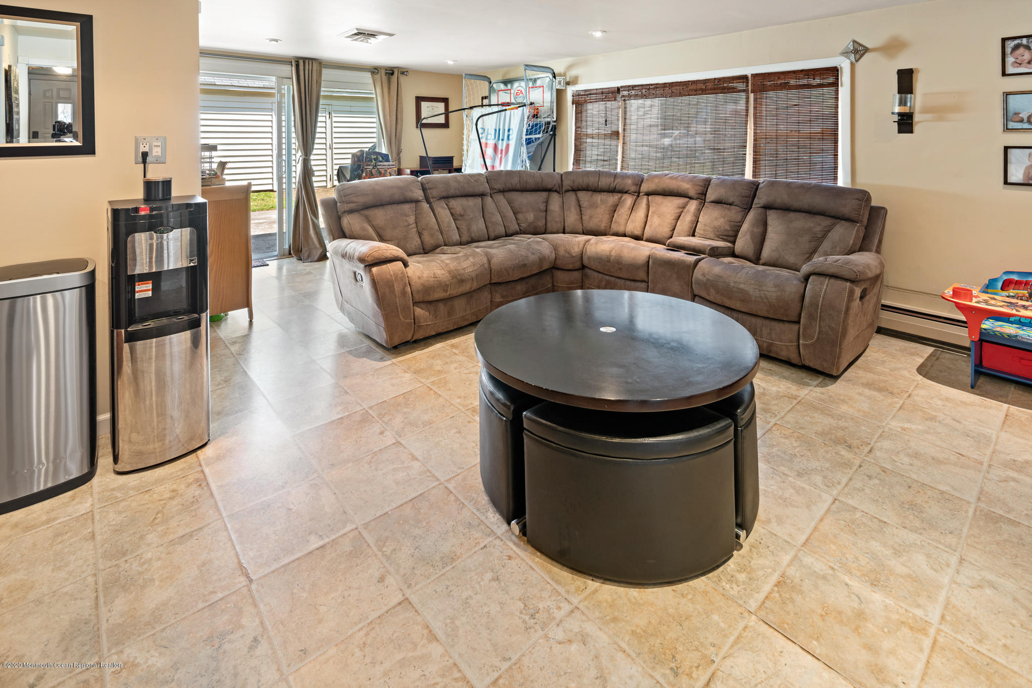 71 Broadway Keyport, NJ 07735 - Photo 6 of 27 a living room with couches and kitchen view with wooden floor