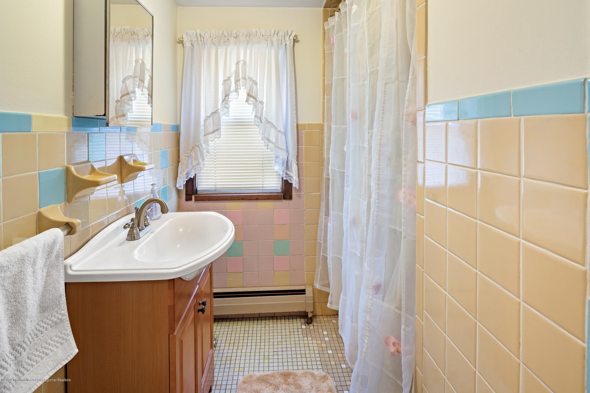 71 Broadway Keyport, NJ 07735 - Photo 10 of 27 a bathroom with a sink and a mirror