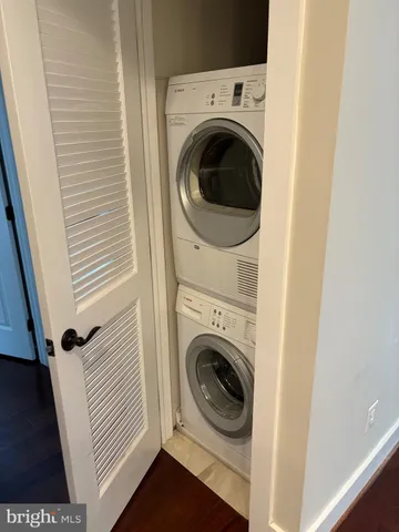 a view of a livingroom with wooden floor and a window