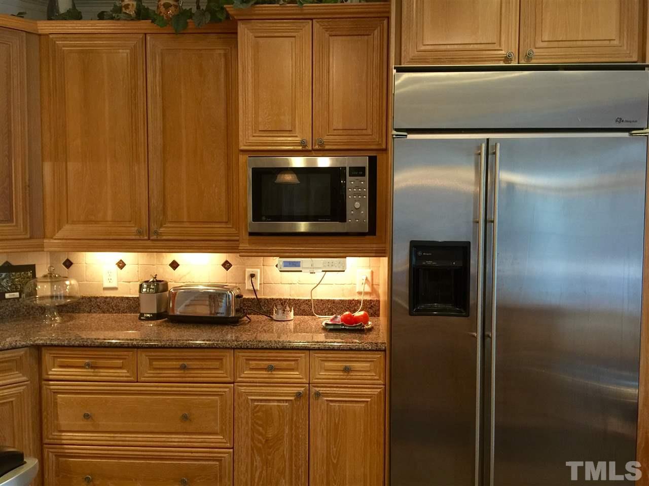3424 Peebles Road Raleigh, NC 27616 - Photo 8 of 25 a kitchen with stainless steel appliances granite countertop a refrigerator and a sink