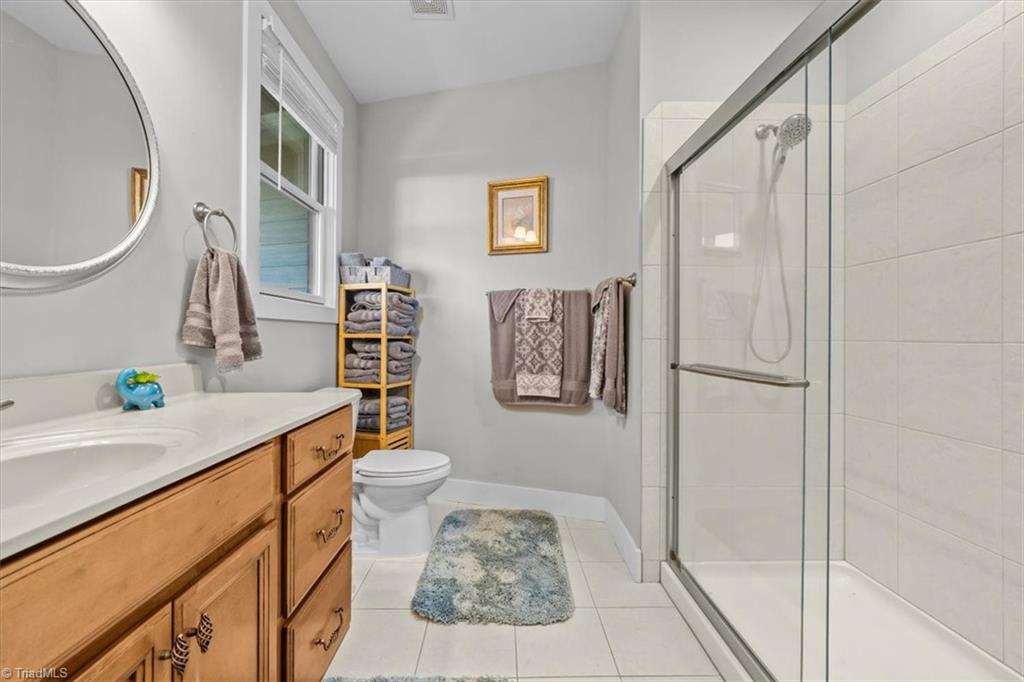 2207 Sierra Trace Road Denton, NC 27239 - Photo 30 of 49 Private ensuite bathroom featuring a walk-in shower and generous vanity space