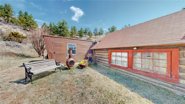 a view of a two chairs in the patio