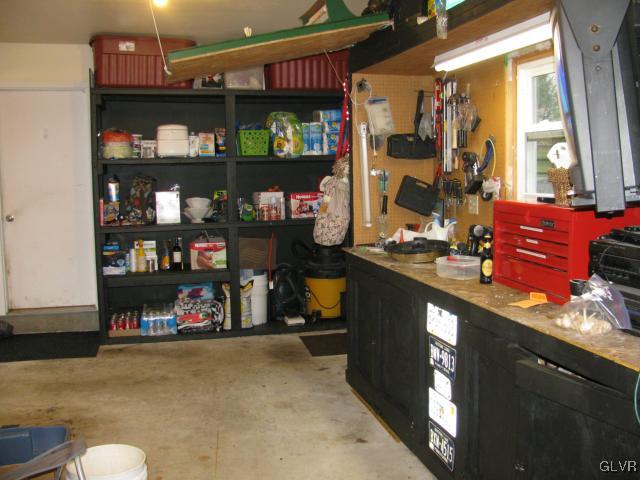 1517 Fernwood Road Slatington, PA 18080 - Photo 27 of 37 Shelving and work bench in garage