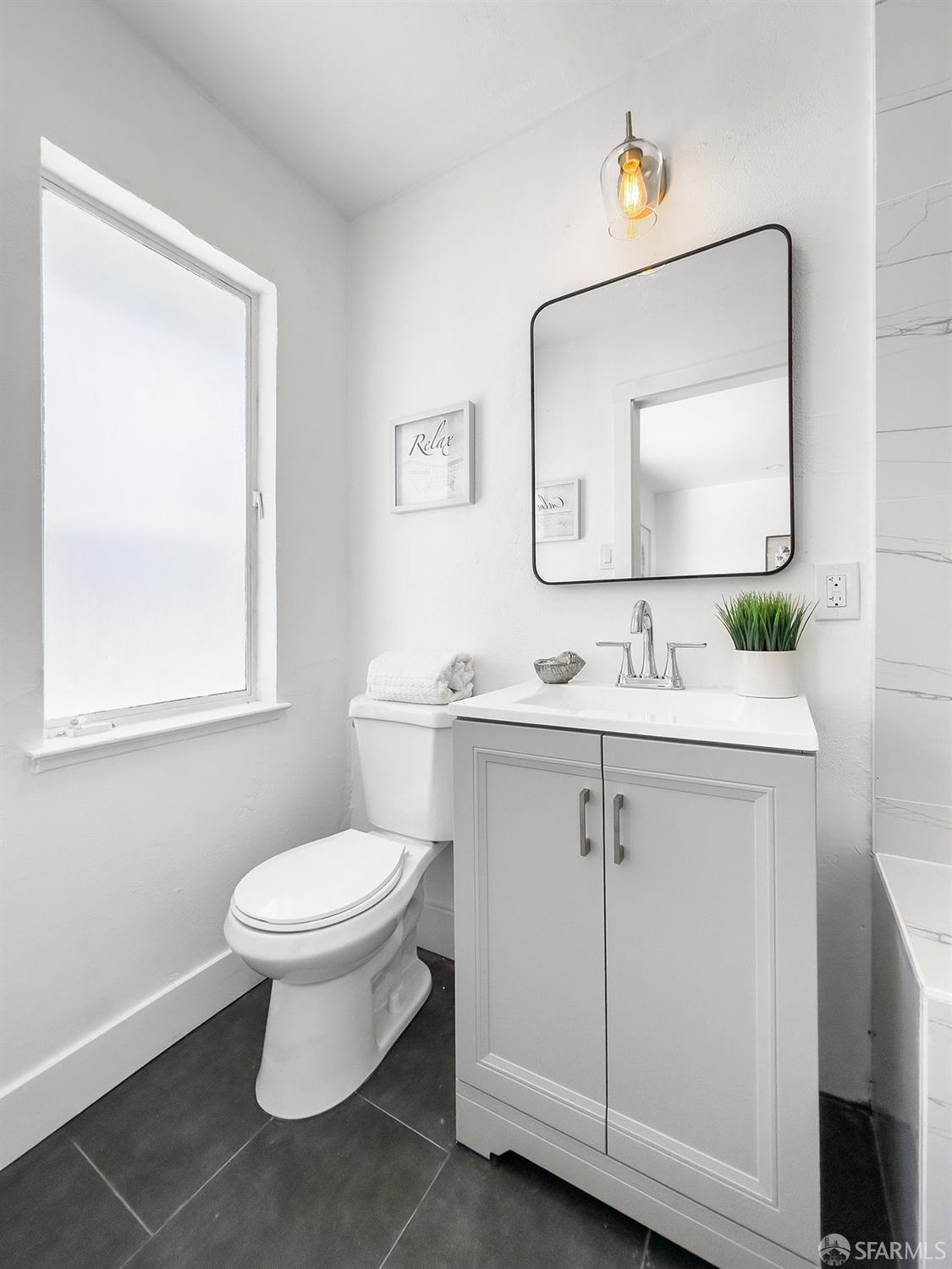 2531 Jerilynn Drive Concord, CA 94519 - Photo 17 of 34 a bathroom with a sink toilet a mirror and vanity
