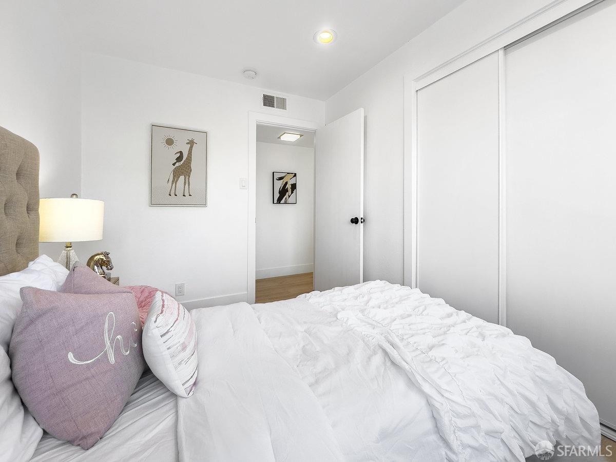 2531 Jerilynn Drive Concord, CA 94519 - Photo 22 of 34 a bedroom with a bed and a lamp on dresser