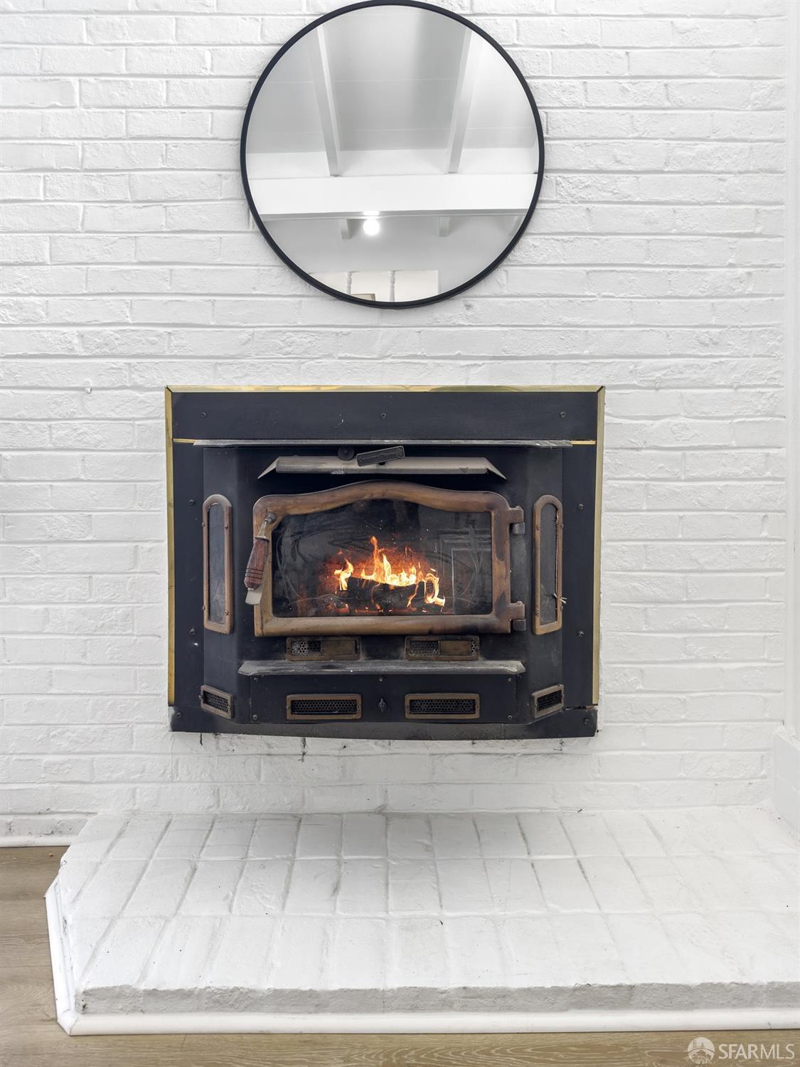 2531 Jerilynn Drive Concord, CA 94519 - Photo 7 of 34 a fireplace with a vase and a lamp on it