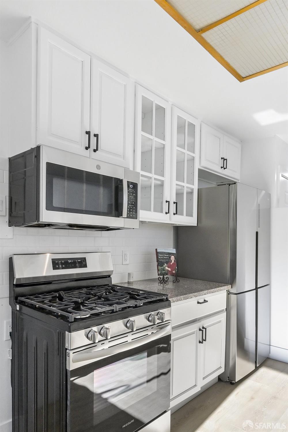 2531 Jerilynn Drive Concord, CA 94519 - Photo 10 of 34 a kitchen with stainless steel appliances white cabinets and a stove top oven