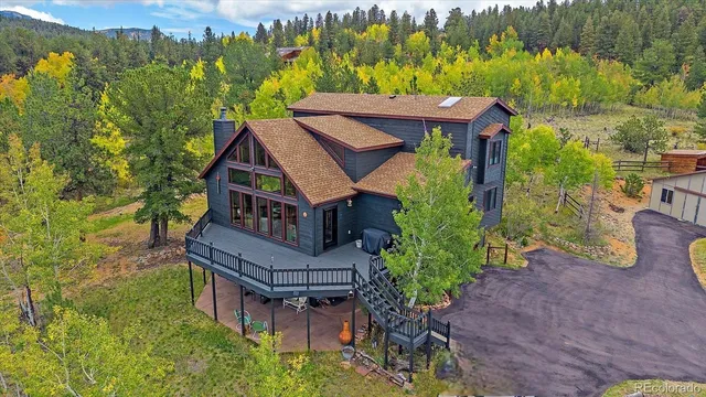 an aerial view of a house with a garden