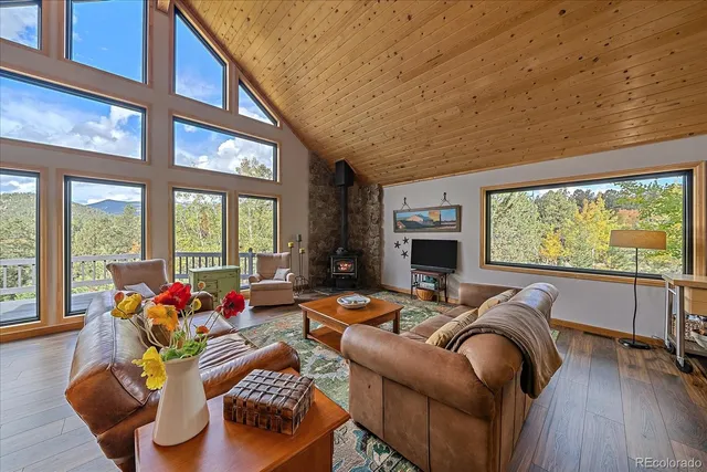 a living room with furniture fireplace and flat screen tv