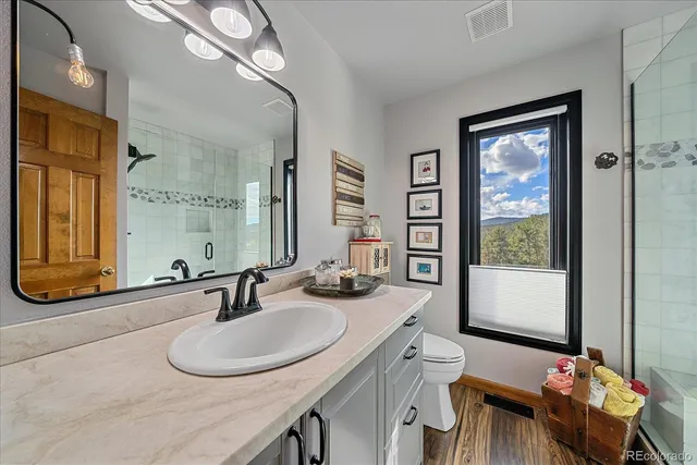 a bathroom with a sink double vanity and a mirror