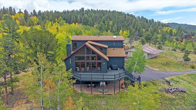 an aerial view of a house with a garden