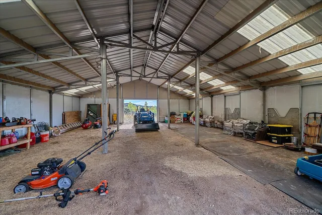 a view of parking garage with cars