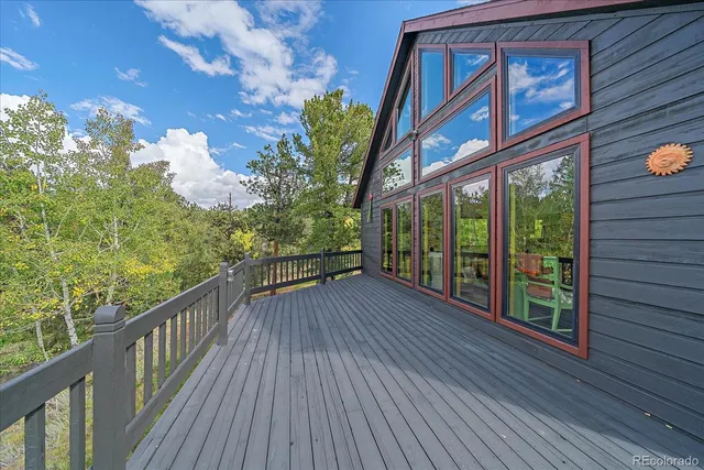 a view of a balcony with wooden floor