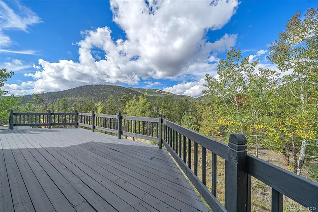a view of a balcony with wooden floor