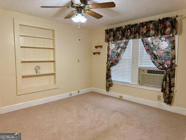 a view of a livingroom with a staircase
