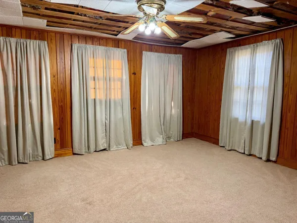 a view of an empty room with a window