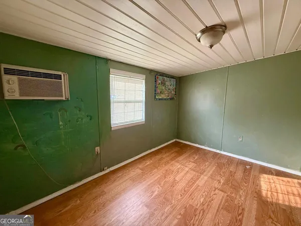 a view of empty room with windows