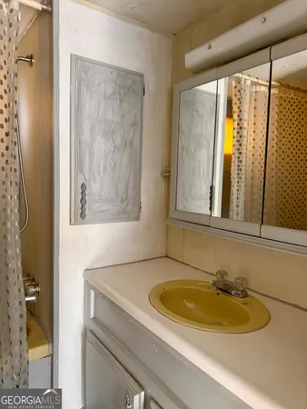 a bathroom with a sink and a mirror