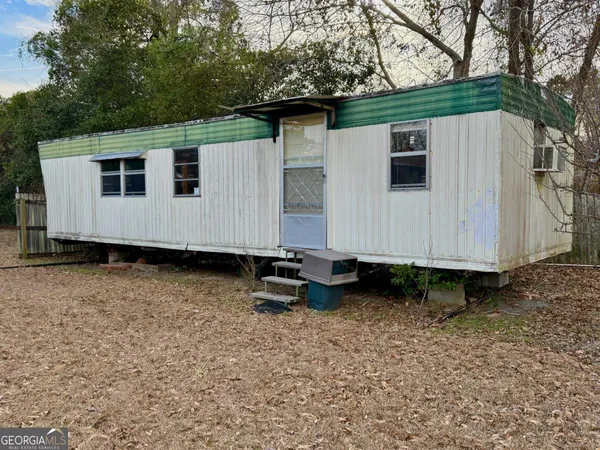 a view of a small white house