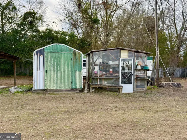 a view of a car park in front of a house