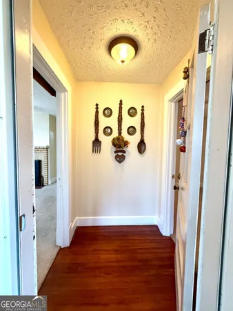 a view of front door with wooden floor
