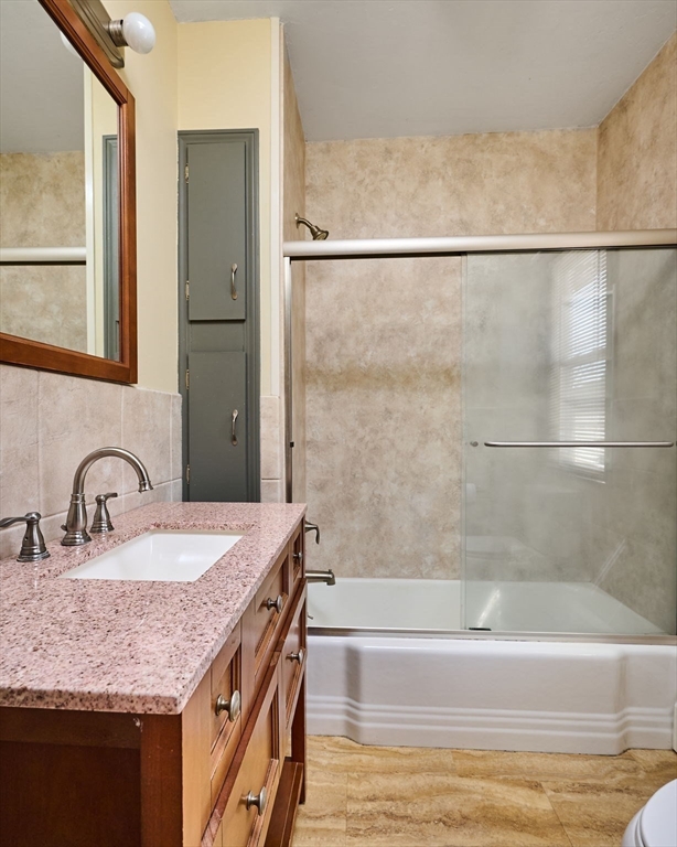 5 Ruggles Street Three Rivers, MA 01080 - Photo 11 of 30 a bathroom with a granite countertop bathtub sink vanity and mirror
