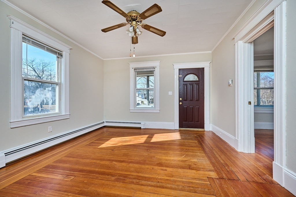 5 Ruggles Street Three Rivers, MA 01080 - Photo 5 of 30 a view of an empty room with window and wooden floor