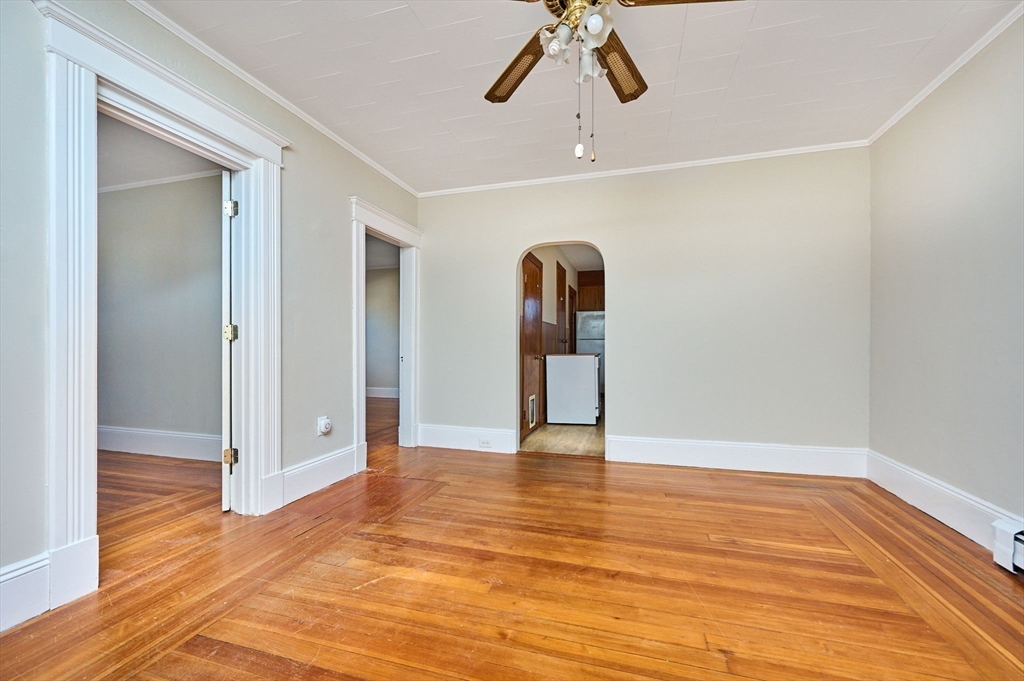5 Ruggles Street Three Rivers, MA 01080 - Photo 6 of 30 a view of an empty room and window with wooden floor