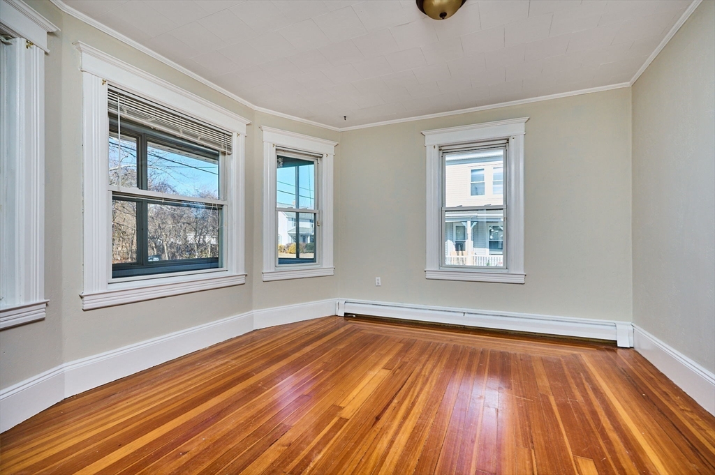 5 Ruggles Street Three Rivers, MA 01080 - Photo 7 of 30 a view of an empty room with window and wooden floor