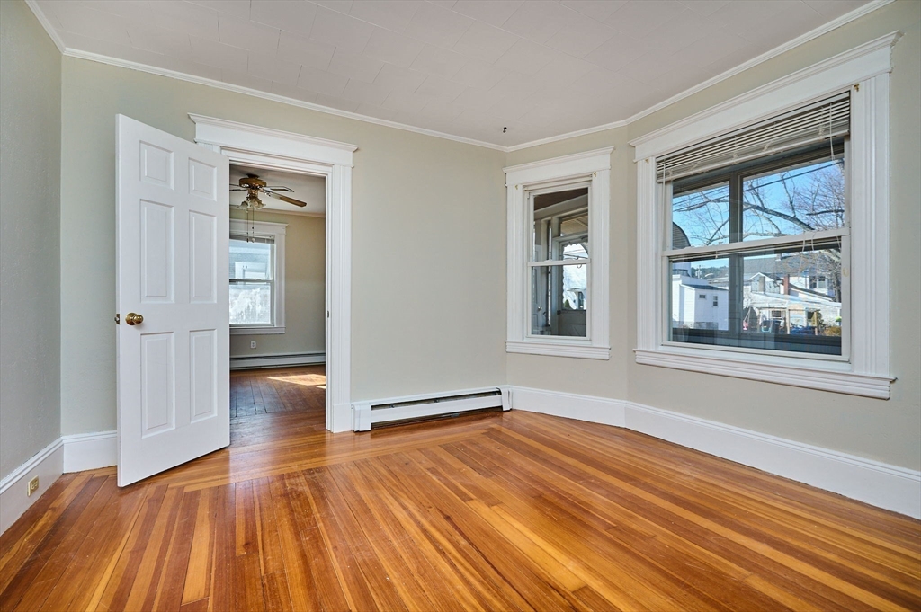 5 Ruggles Street Three Rivers, MA 01080 - Photo 8 of 30 a view of an empty room with wooden floor and a window