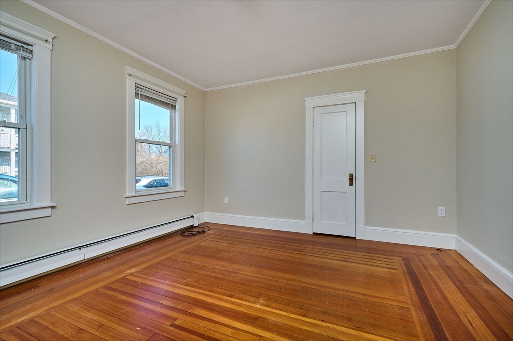5 Ruggles Street Three Rivers, MA 01080 - Photo 9 of 30 a view of an empty room with wooden floor and a window