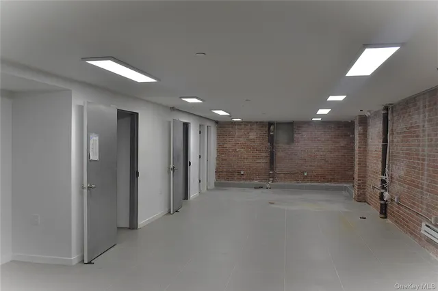 an empty room with closet and a bathroom