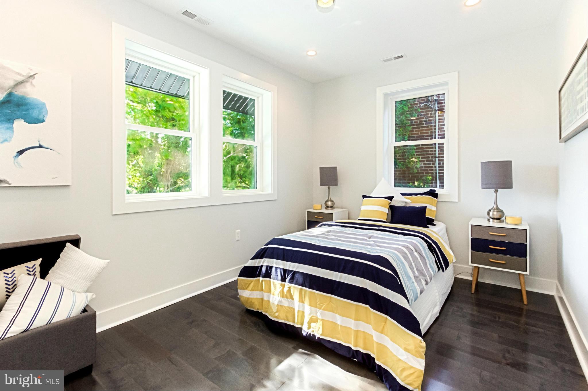 7533 12th Street Northwest Washington, DC 20012 - Photo 13 of 30 a bedroom with a bed and a window
