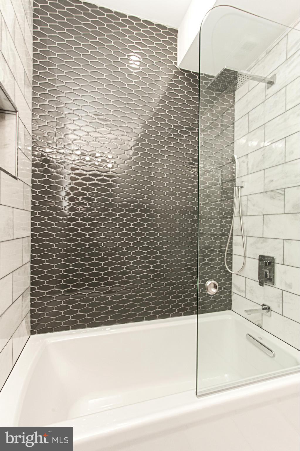 7533 12th Street Northwest Washington, DC 20012 - Photo 19 of 30 a bathroom with a bathtub and shower