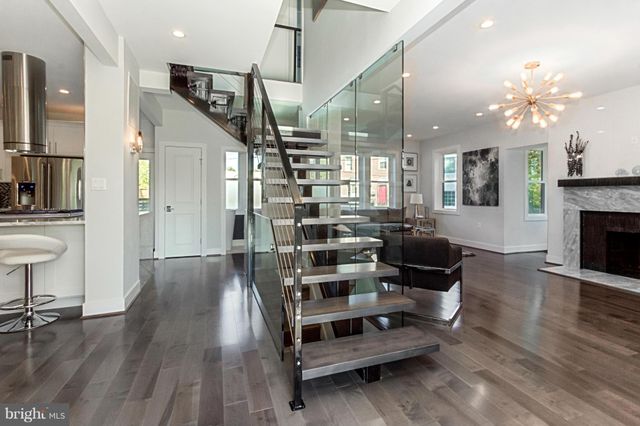 a view of a livingroom with furniture and a fireplace
