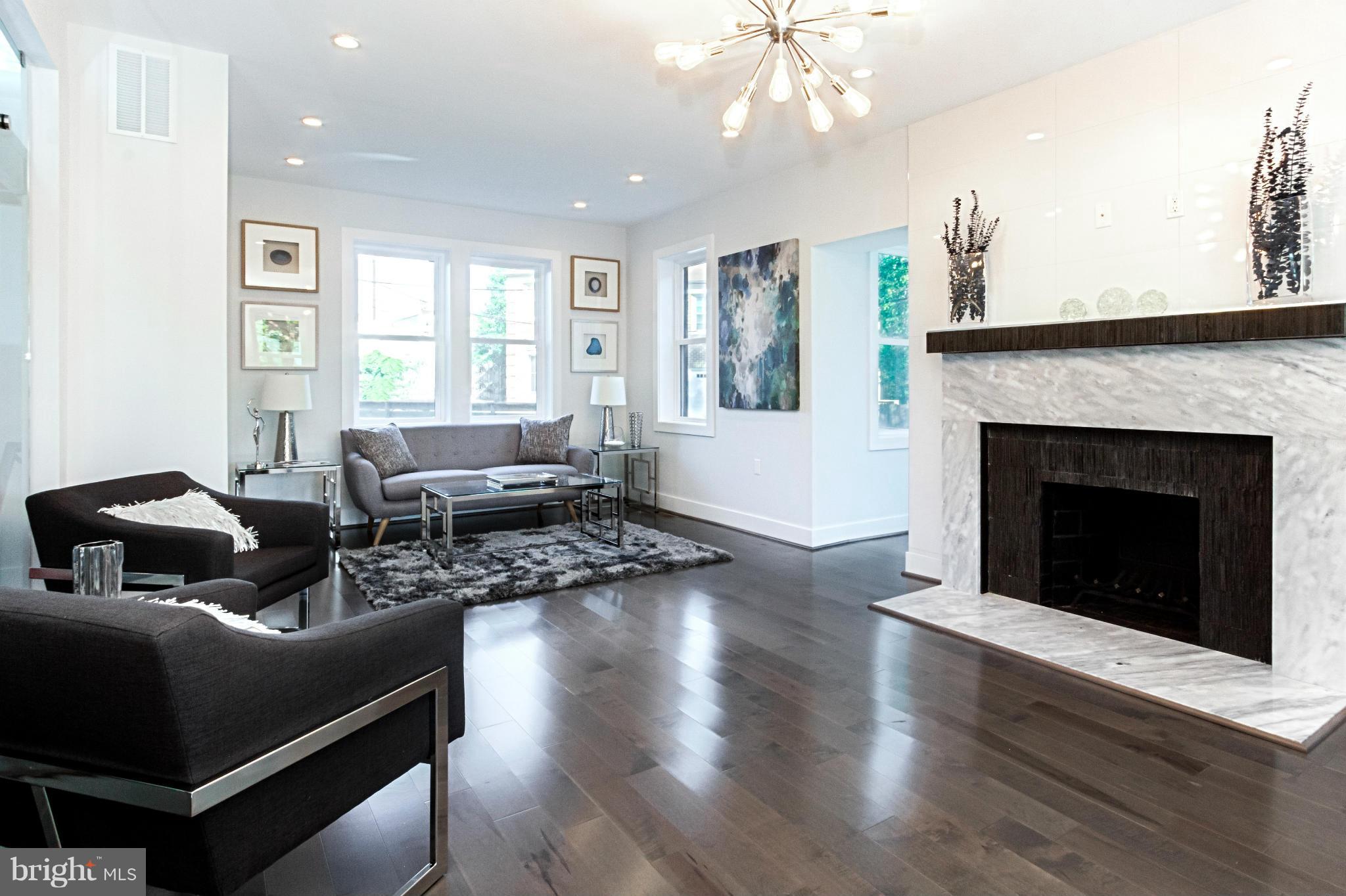 7533 12th Street Northwest Washington, DC 20012 - Photo 4 of 30 a living room with furniture and a fireplace