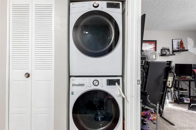 a view of a hallway with washer and dryer