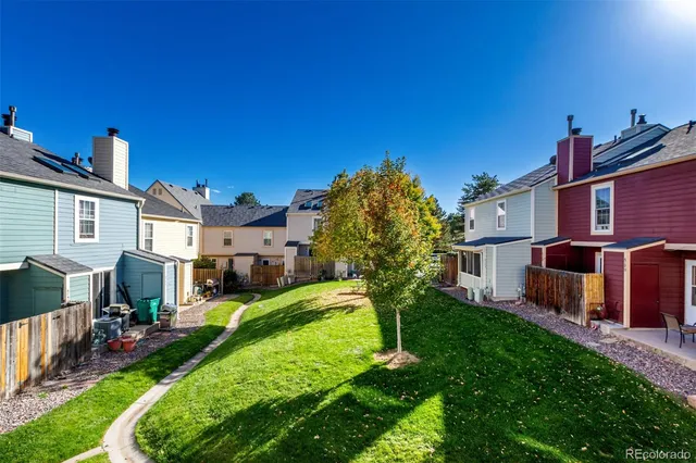 a view of a house with a yard porch and sitting area