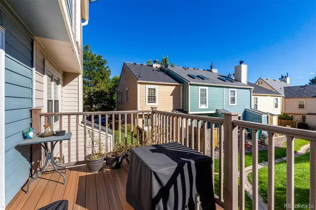 a view of a brick wall with a deck