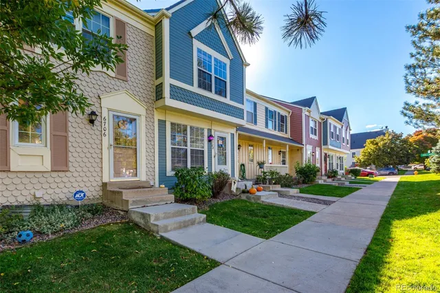 a front view of a house with garden and porch