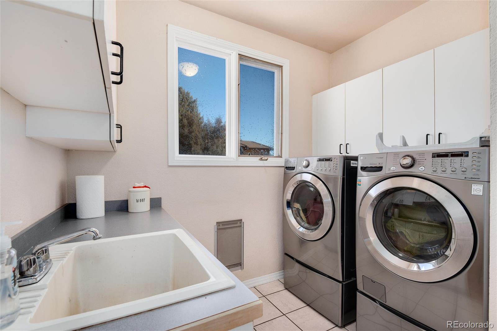 81 North Ranch Road Littleton, CO 80127 - Photo 13 of 38 a utility room with sink dryer and washer